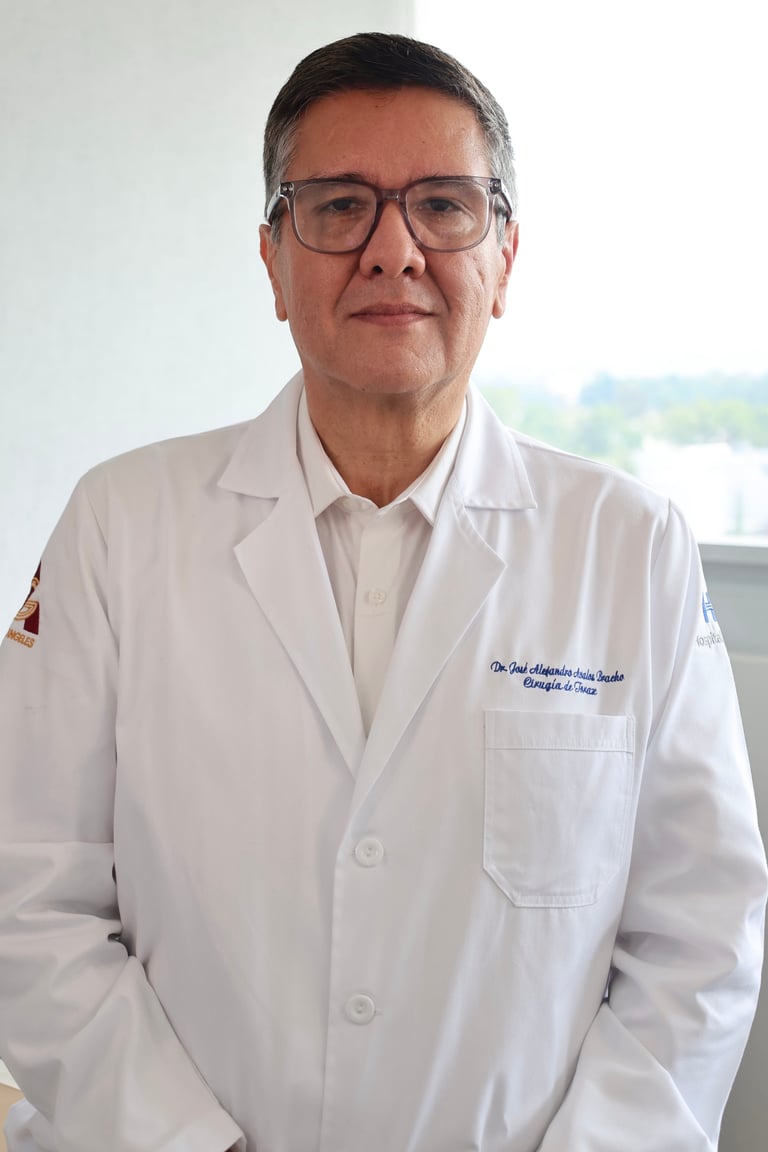 Middle-aged man wearing glasses and a white medical lab coat, standing in front of a bright window in a clinical setting